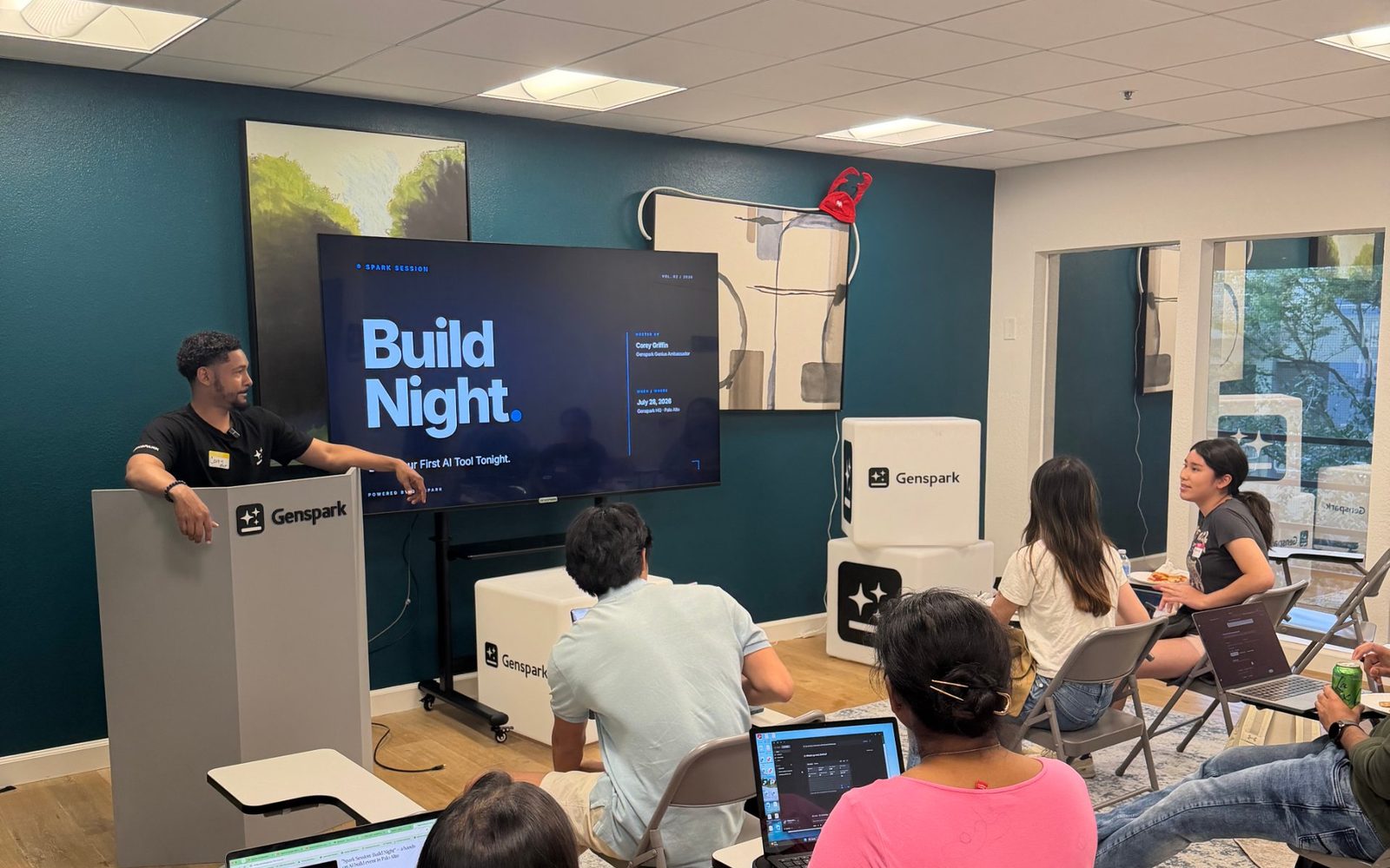 A Spark Night in progress — attendees building with Genspark on screen