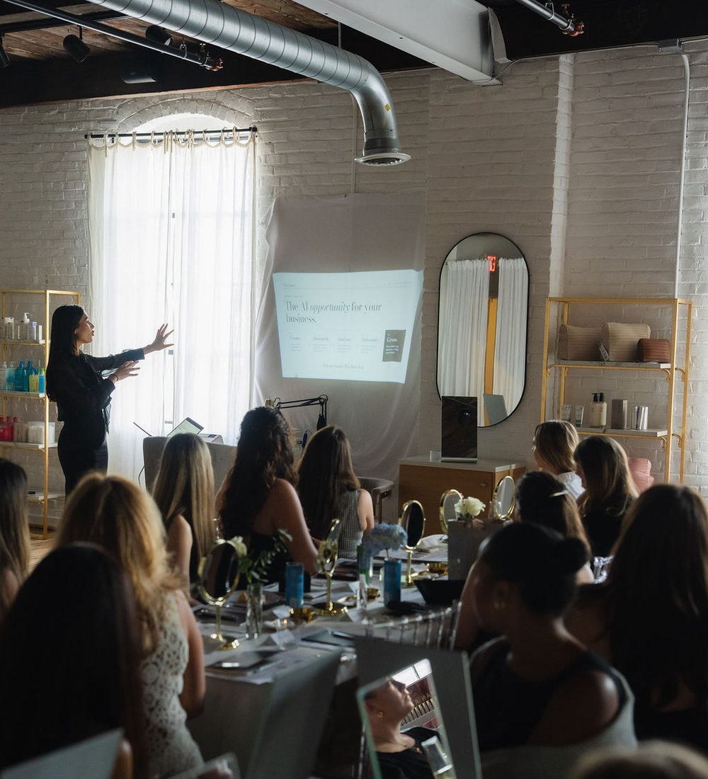 Host addressing the room during the share phase